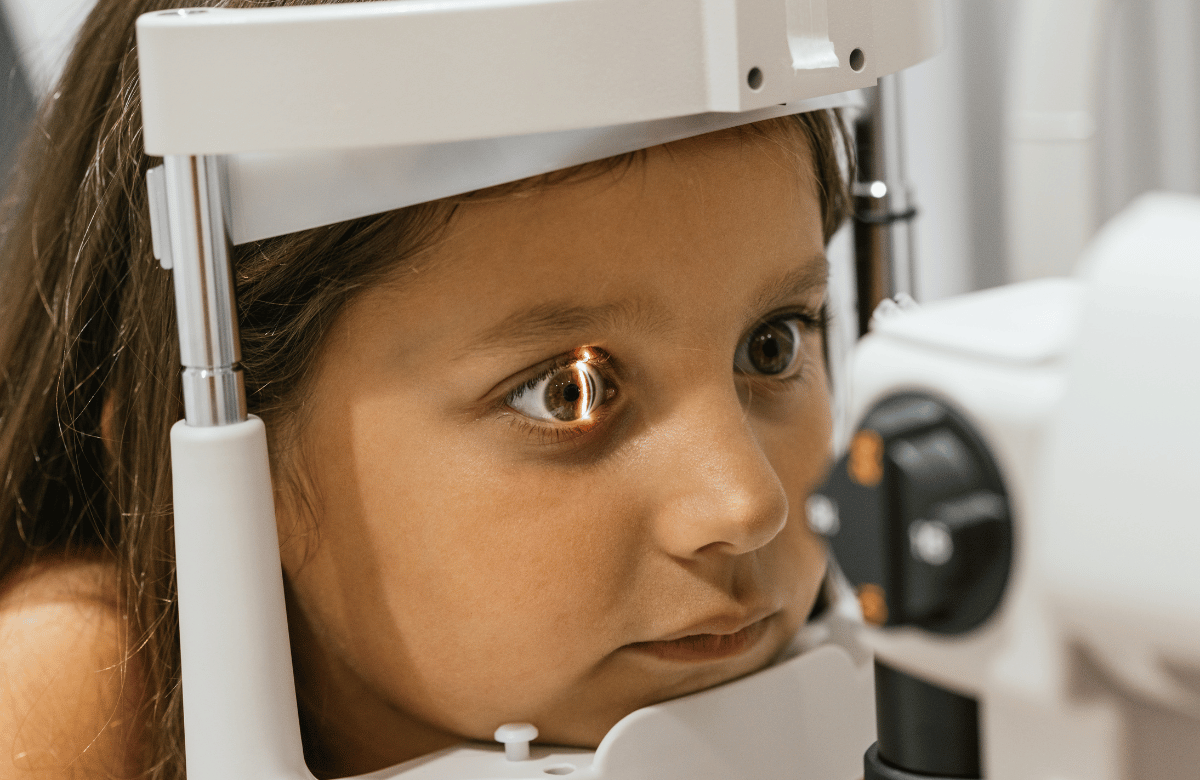 a little girl getting an eye exam