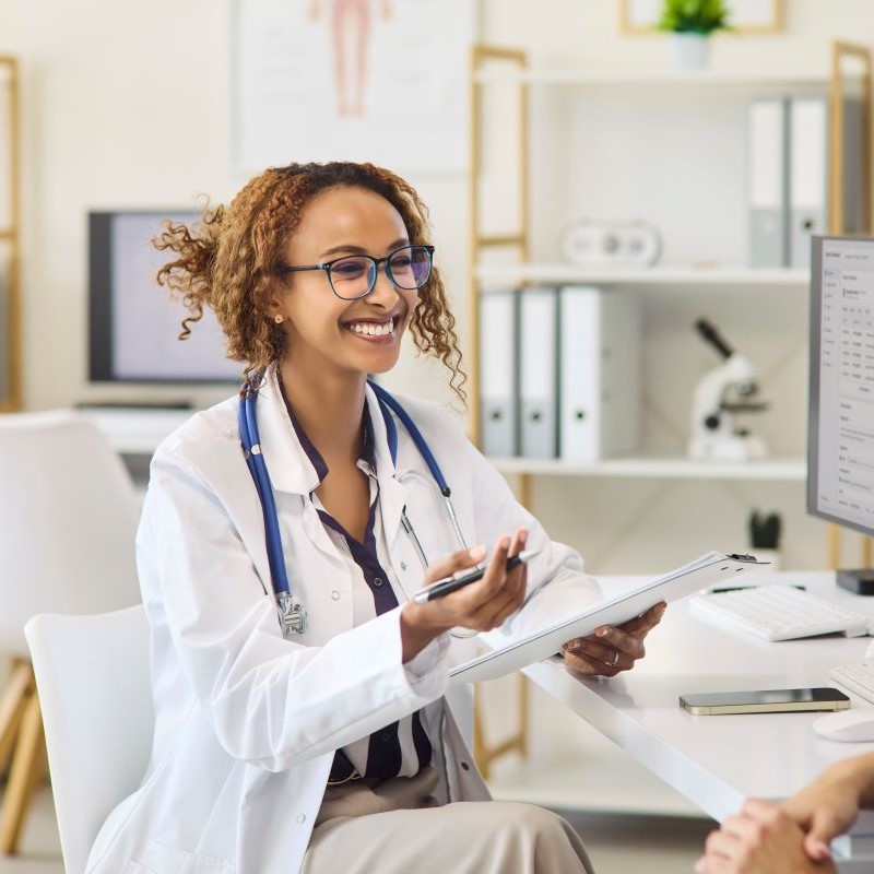 Optometrist giving a Referral to a patient